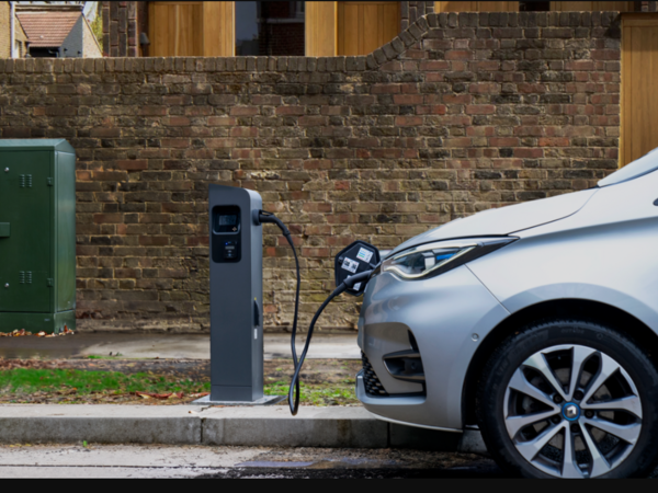 An electric vehicle being charged
